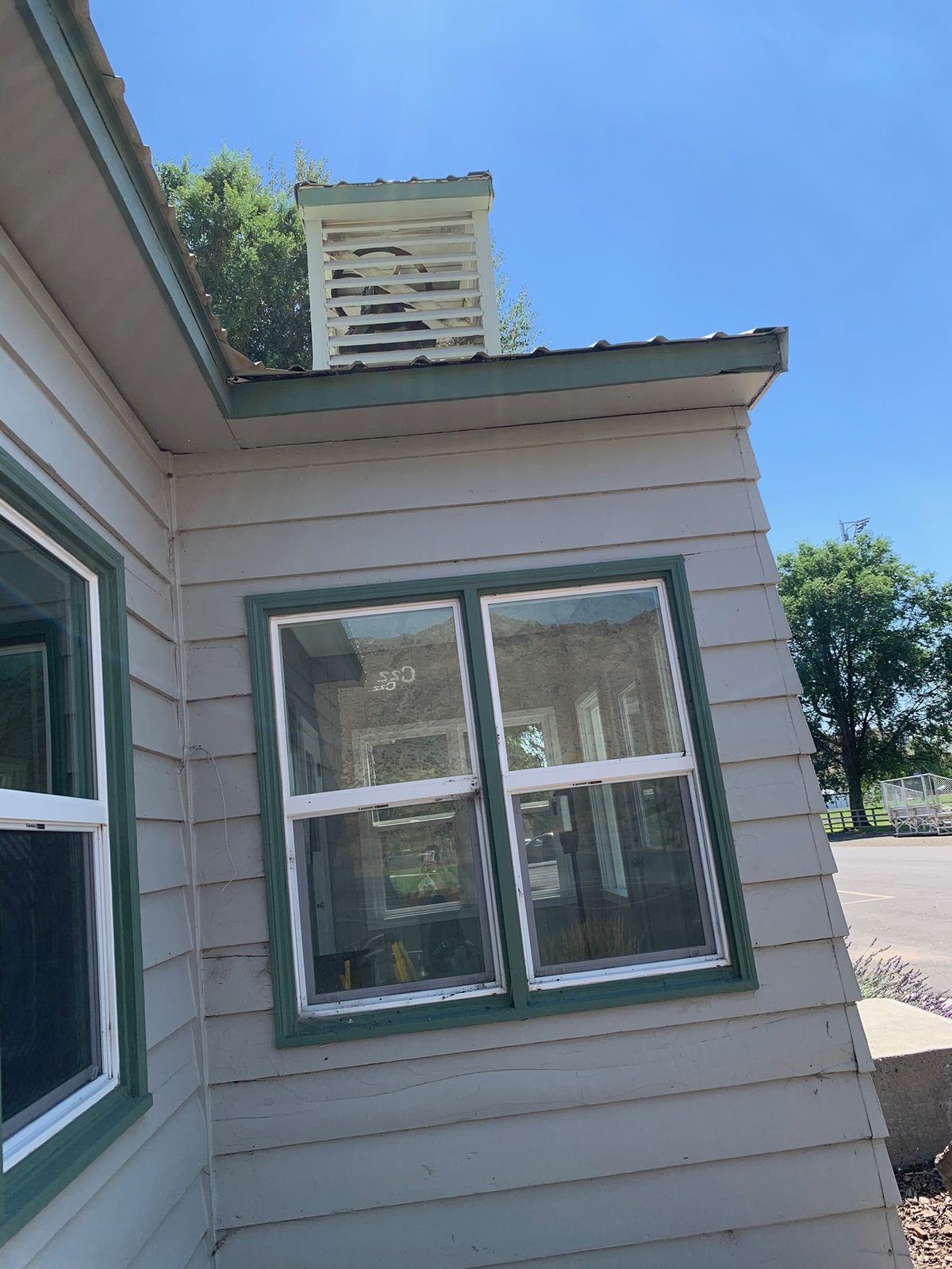 Exterior view of a home with newly installed windows and clean trim work.