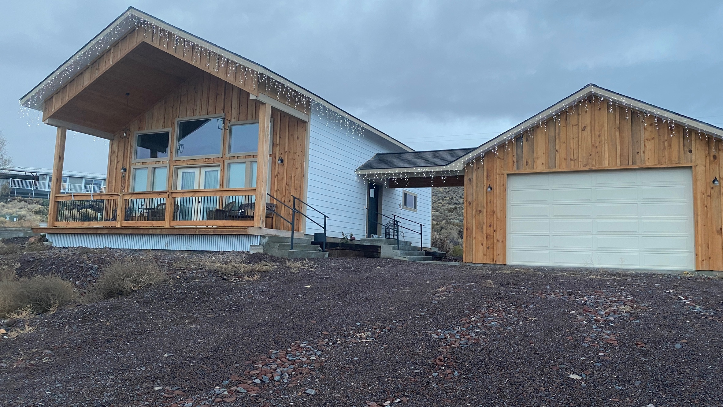 Finished residential exterior showing a property secured and restored to serviceable condition.